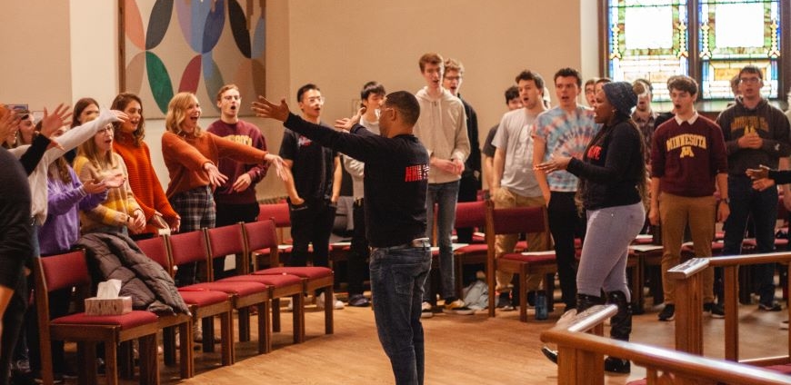 New Hope International co-founder Brendon Adams teaches UMN choir students.