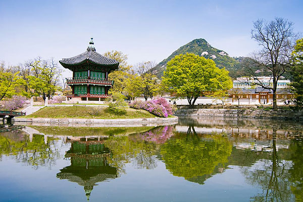 Korean temple near a lake and mountain