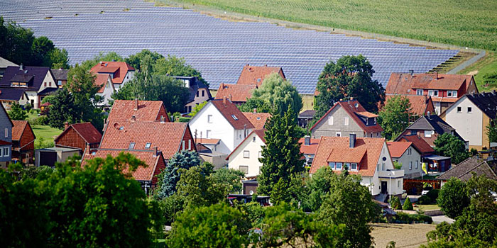 Solar field behind houses in Germany