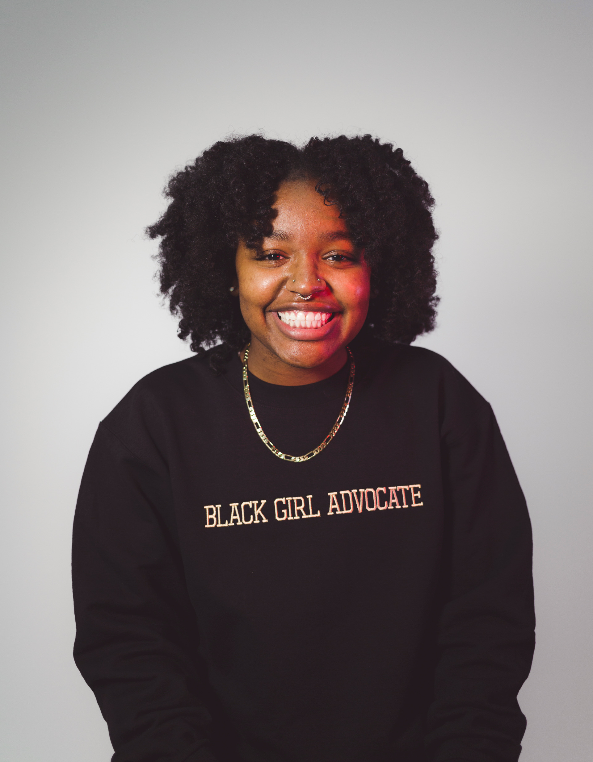 Shamaria Jordan wearing a Black Girl Advocate sweatshirt