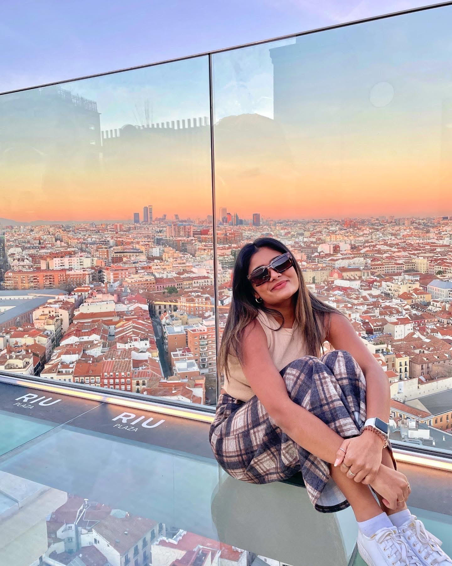 Zeel Patel on a rooftop in Madrid at sunset