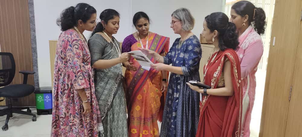 ICI's Renáta Tichá working with counseling staff at KL University in Andhra Pradesh, India.