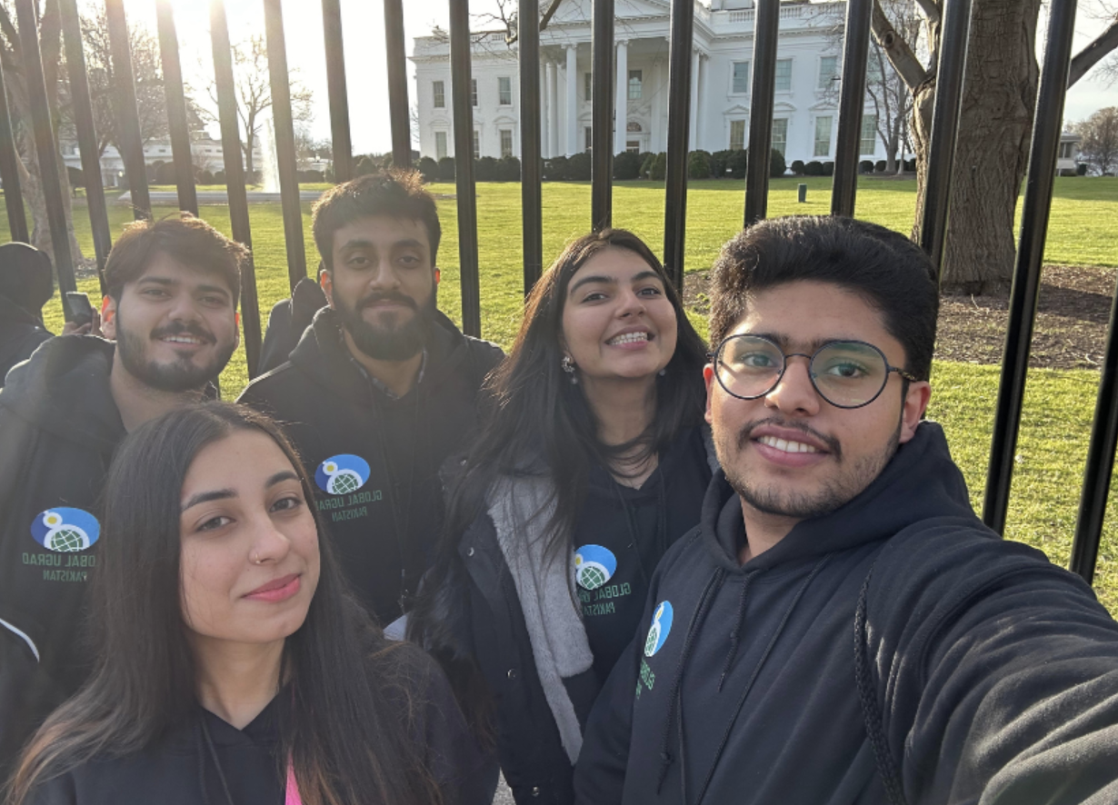 Kashaf in front of the white house with other students 