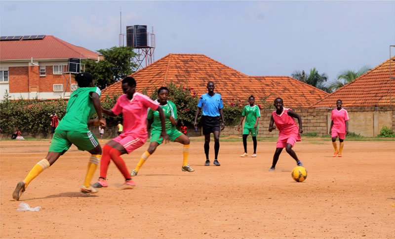 Women playing soccer in Uganda