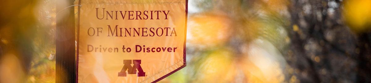 Gold banner with text that says University of Minnesota Driven to Discover