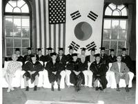 A photograph of the ceremony for the conferment of an Honorary Doctorate (Law) on the Honorable Arthur E. Schneider. The date is unknown.