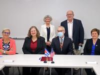 Faculty and staff representing the University of Minnesota pictured after the signing of an agreement with the National School of Public Health in Cuba (ENSAP). 