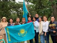Upon meeting in Minnesota, the scholars display the flag of their homeland, Kazakhstan.