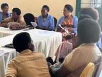 A village meeting of autism acceptance advocates and community health workers in rural Rwanda in July 2023.